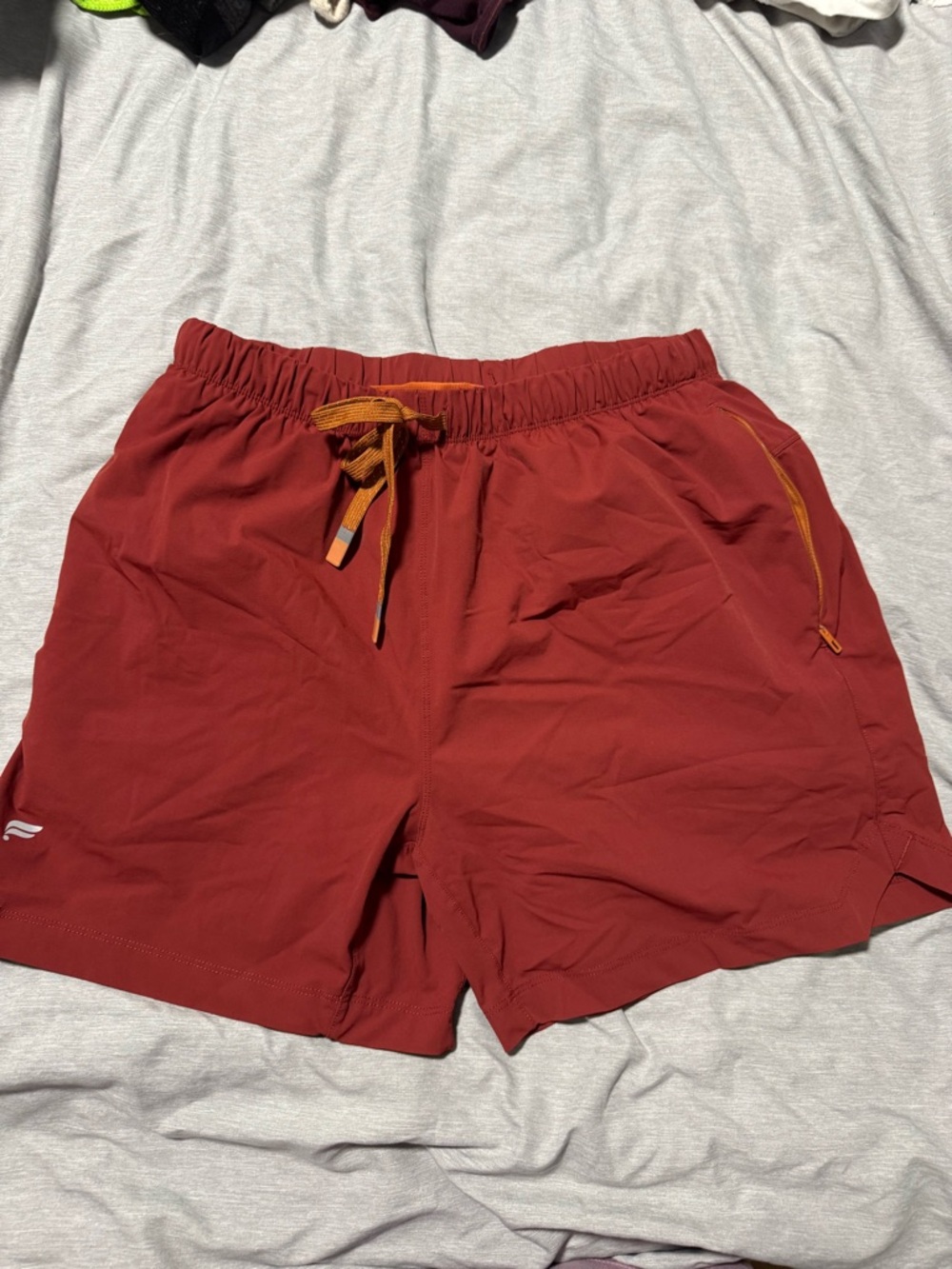 Fabletics Men's Athletic Drawstring Shorts in Deep Red with Orange Accents